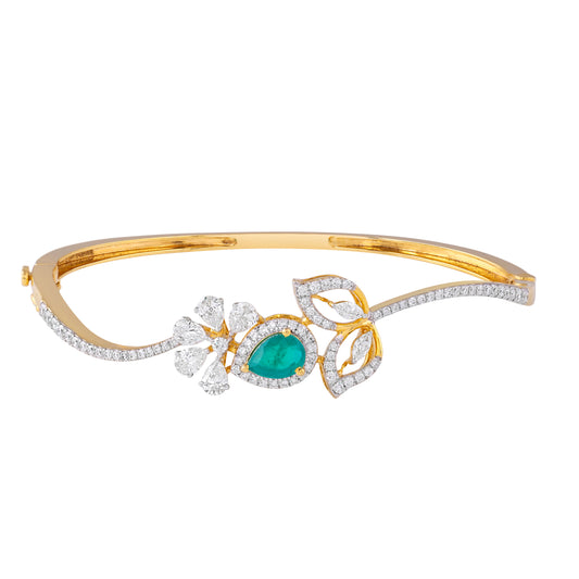 Everlume Jewels gold bangle featuring a pear-cut emerald and lab-grown diamonds
