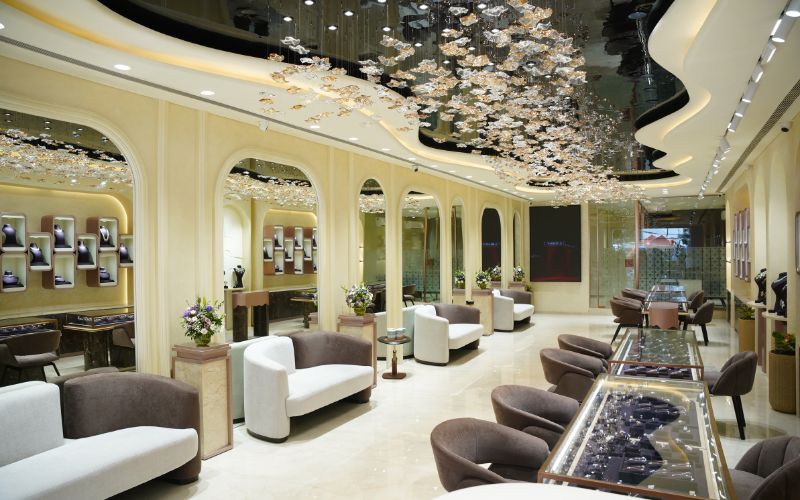 Luxurious lab grown diamond jewellery showroom with modern seating and elegant lighting.